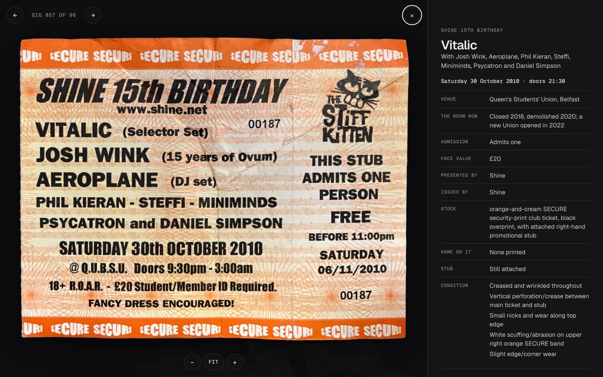 A paper ticket picked up, filling the left of the screen: Shine 15th Birthday, Vitalic, Josh Wink, Aeroplane and more, Saturday 30th October 2010 at Queen's Students' Union, printed black on orange-and-cream SECURE security paper, with a Stiff Kitten stub that admits one person free before 11pm. Beside it, everything about the ticket: the venue, the room now (closed 2018, demolished 2020), admission, the £20 face value, who presented and issued it, the paper, and its condition.